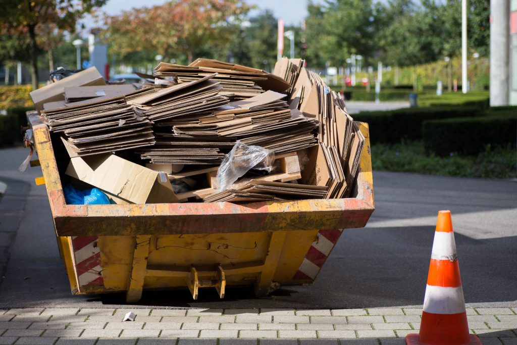 skip full of boxes