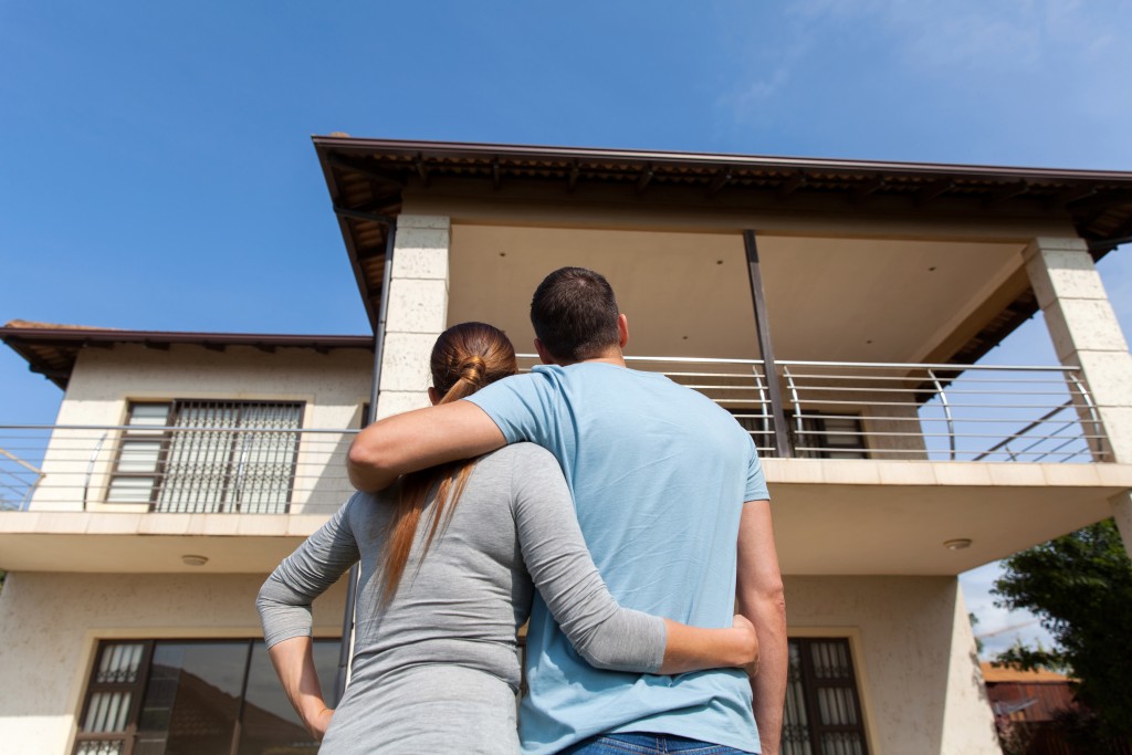 couple and house