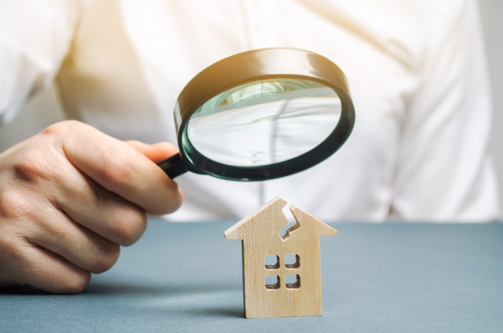 person holding a magnifying glass